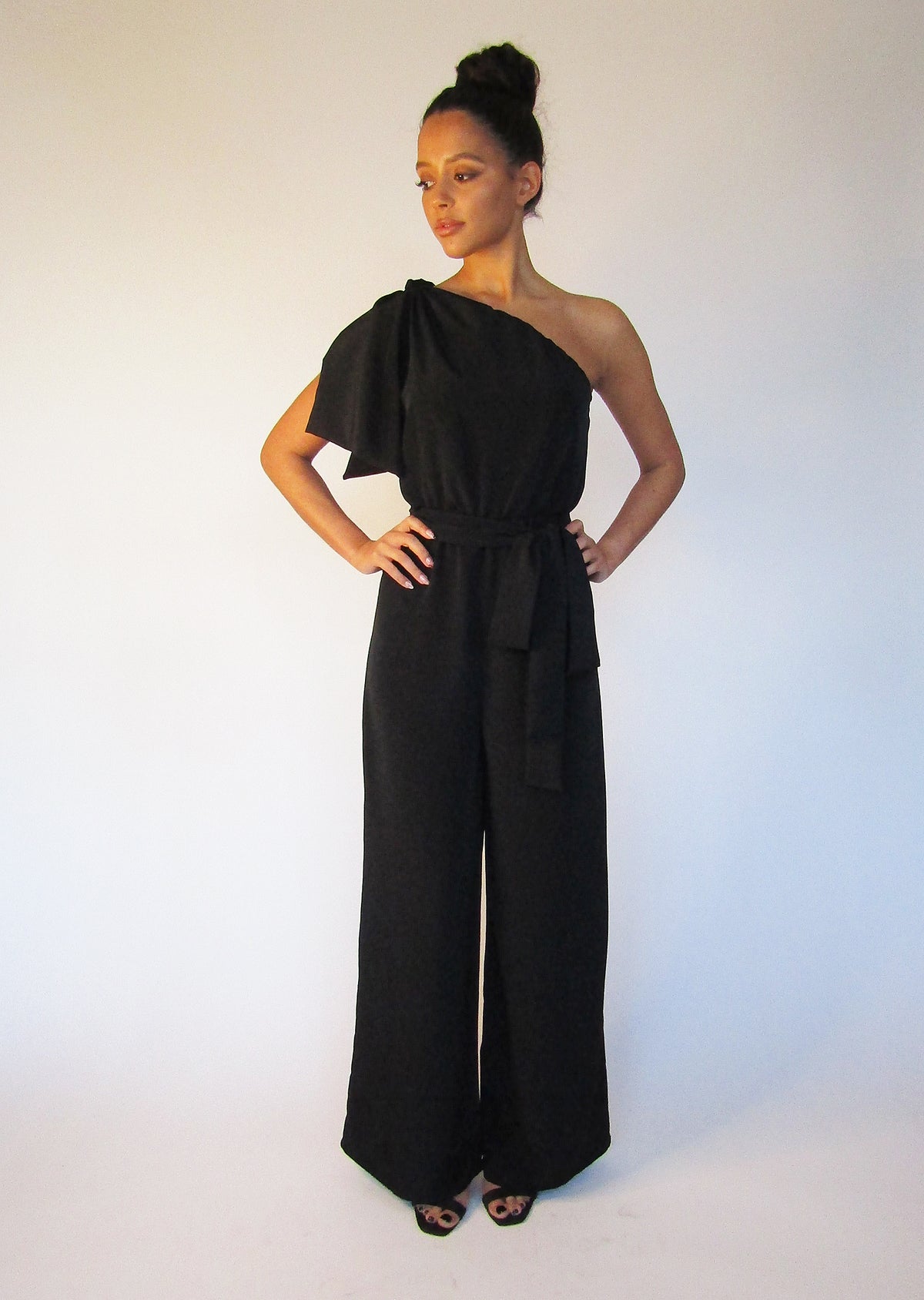 petite black  jumpsuit with wide legs and one sleeve.