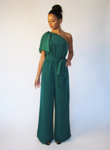 petite green jumpsuit with wide legs and one sleeve.
